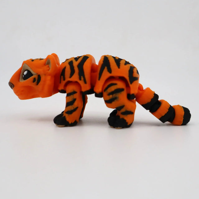 3D printed orange and black striped tiger sensory toy for children on white background