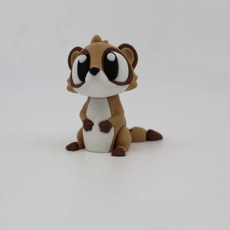 Cute brown and white 3D printed animal sensory toy with large eyes on white background