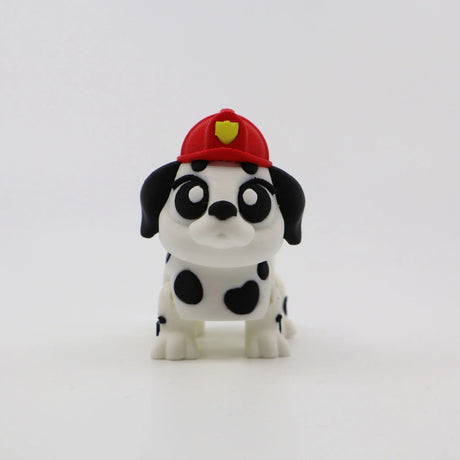 3D printed Dalmatian puppy fidget toy with red firefighter hat, sensory-friendly design for kids