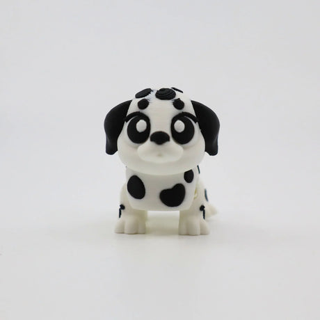 3D printed Dalmatian puppy fidget toy with black spots and big eyes for sensory play