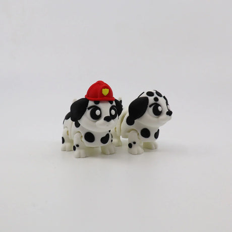 3D printed Dalmatian puppy toys, one with red firefighter hat, sensory fidget figures for kids