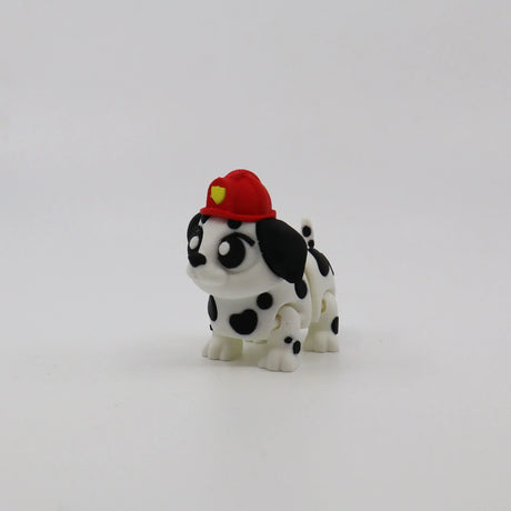 3D printed Dalmatian puppy fidget toy with red firefighter hat, sensory-friendly design for kids
