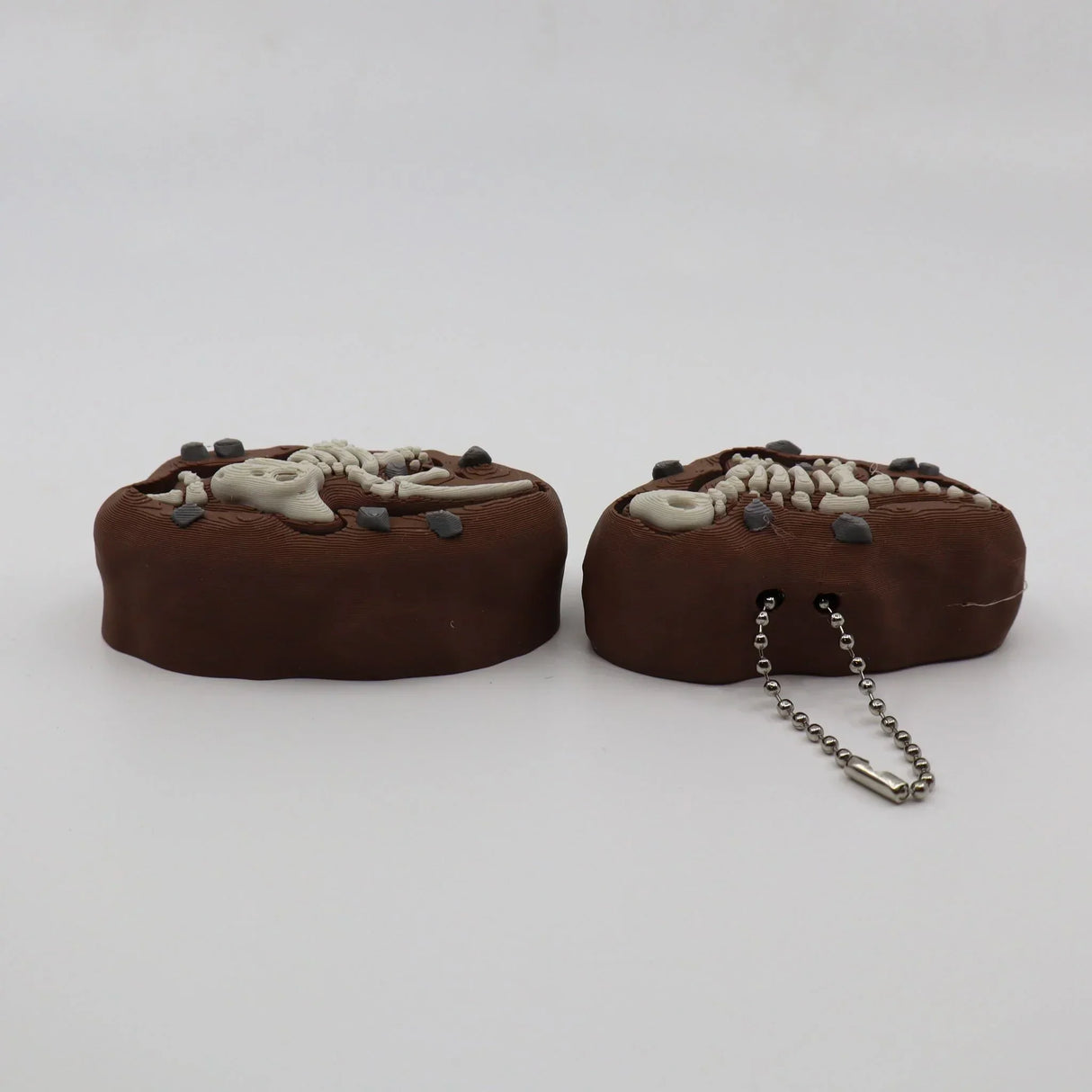 3D printed dinosaur fossil sensory toy with chain, ideal for tactile exploration and learning