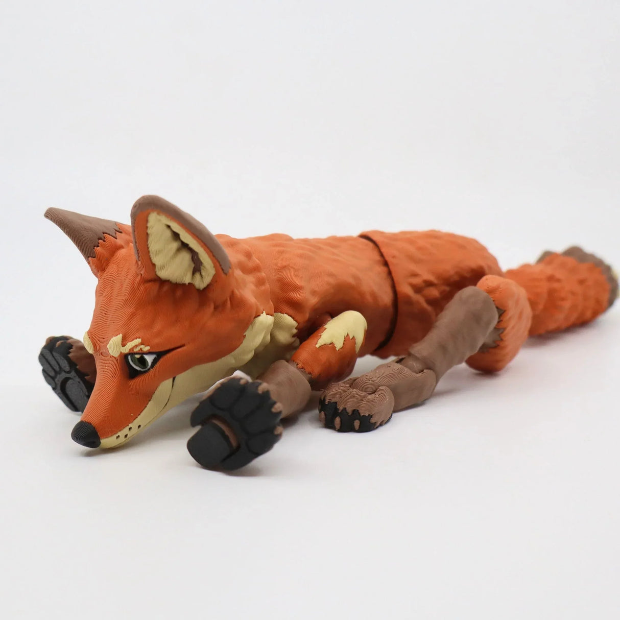 3D printed flexible fox sensory toy with jointed limbs on a white background