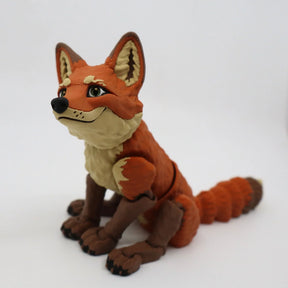 3D printed orange fox sensory toy with flexible joints on white background