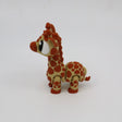 3D printed sensory giraffe toy with orange spots on a white background