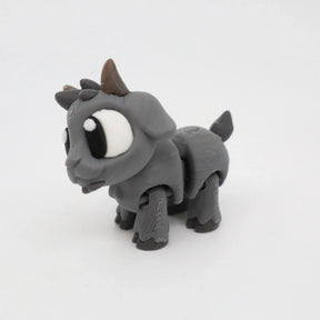 Gray 3D printed goat sensory toy with large eyes on a white background