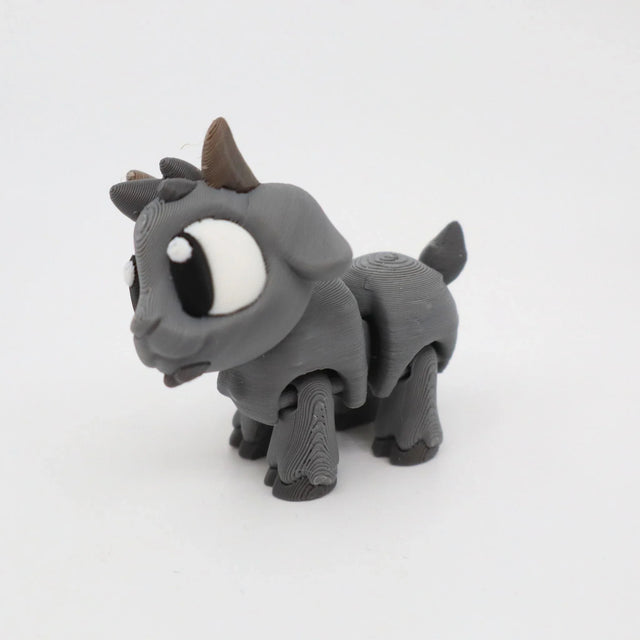 Gray 3D printed goat sensory toy with large eyes on a white background