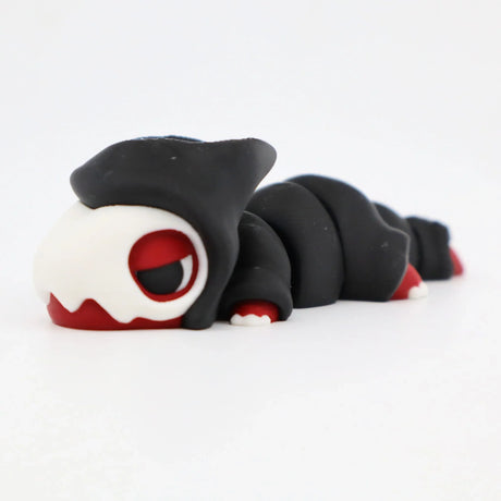 Black and white 3D printed sensory caterpillar toy with red accents on white background