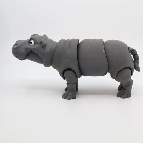 Gray 3D printed hippo sensory toy with movable joints on a white background