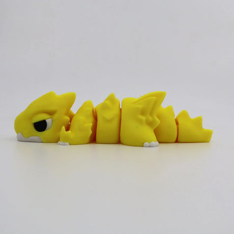 Yellow 3D printed flexi dragon fidget toy for sensory play and tactile stimulation