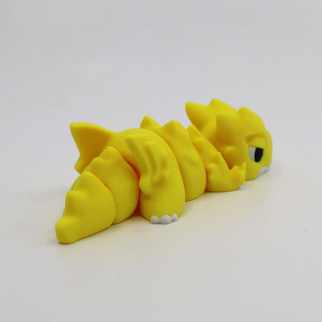 Yellow 3D printed flexi dragon fidget toy for sensory play and stress relief