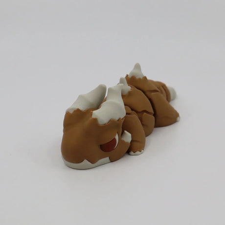 Brown and white 3D printed sensory toy dinosaur figure on a plain white background