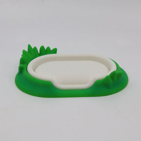 3D printed sensory toy base shaped like a white pond with green grass details