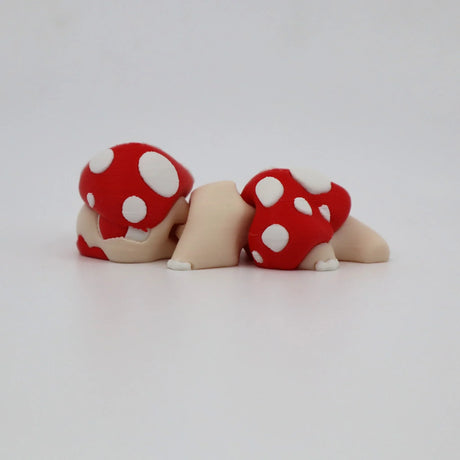 3D printed sensory toy turtle with red and white mushroom shell on white background