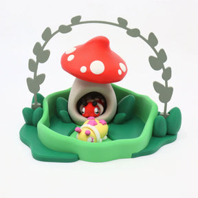 3D printed sensory toy featuring a red mushroom house with cute animal figures, green base