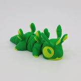 Green and yellow 3D printed caterpillar sensory toy with segmented body on white background.