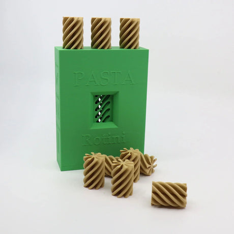 3D printed sensory toy resembling rotini pasta with green storage box, educational tool