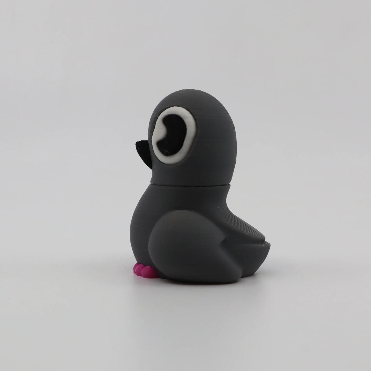 3D printed penguin fidget toy with pink feet, sensory-friendly design for kids