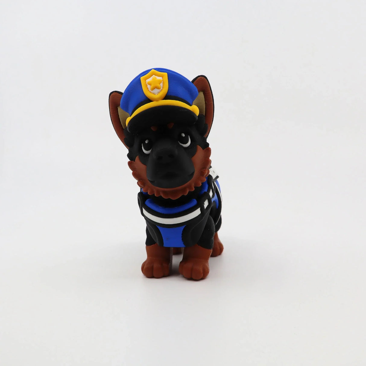 3D printed police dog fidget toy with blue hat and vest, sensory-friendly design for kids