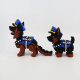 3D printed police dog fidget toys with flexible joints, blue vests, and hats for sensory play