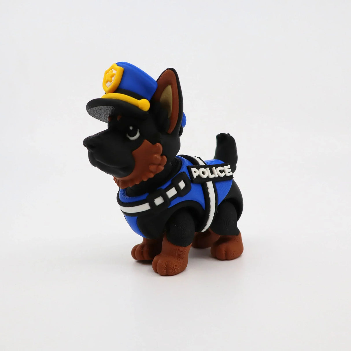 3D printed police dog fidget toy with blue vest and hat, sensory-friendly design for kids