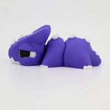 Purple 3D printed sensory toy dragon with white spikes on a white background