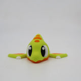 Cute green and orange 3D printed pterodactyl sensory toy with big eyes on white background.