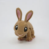 Cute brown 3D printed rabbit sensory toy with big eyes on a white background