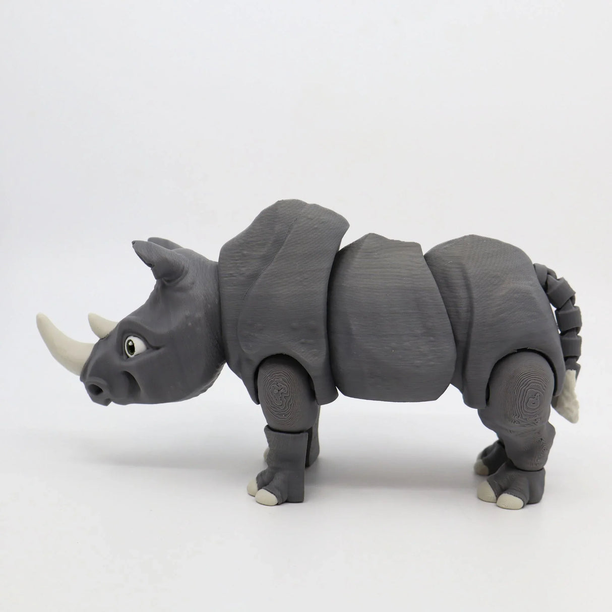 3D printed gray rhino sensory toy with flexible joints, educational animal figure