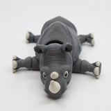 Gray 3D printed rhino sensory toy with movable limbs on white background