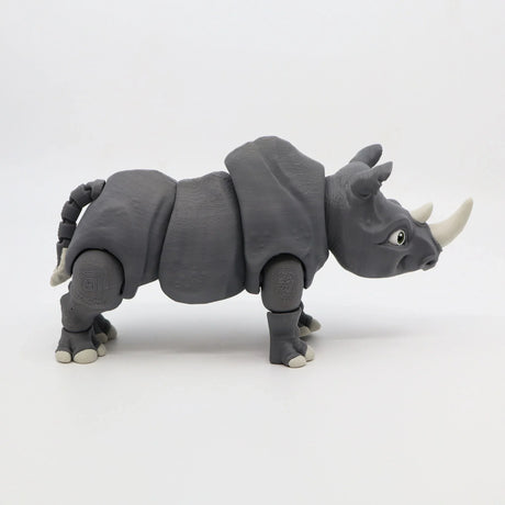 Gray 3D printed rhino sensory toy with movable joints on a white background