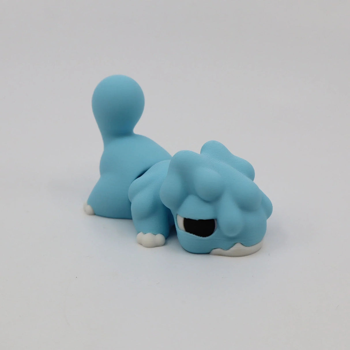 Blue 3D printed sensory toy resembling a playful animal on a plain white background.