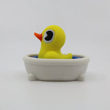 Yellow 3D printed duck fidget toy in mini bathtub, sensory toy for kids