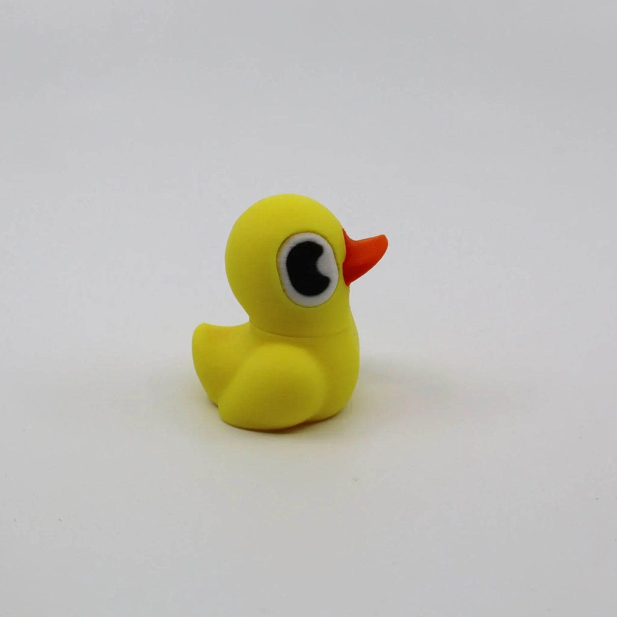 3D printed yellow duck fidget toy with orange beak, sensory-friendly design for kids