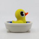 Yellow 3D printed duck fidget toy in white bathtub, sensory toy for kids