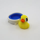 Yellow 3D printed duck fidget toy with blue bath, sensory-friendly design for kids