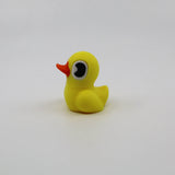 Yellow 3D printed duck fidget toy with orange beak, sensory-friendly design for kids