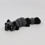 Gray and black 3D printed raccoon fidget sensory toy with segmented body on white background