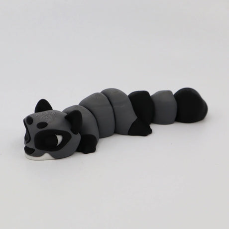 Gray and black 3D printed raccoon fidget sensory toy with segmented body on white background