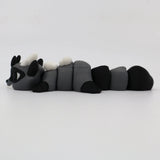 Gray and black 3D printed raccoon flexi sensory toy for kids on white background