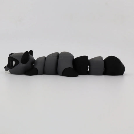 Gray and black 3D printed raccoon fidget toy with segmented, flexible body on white background