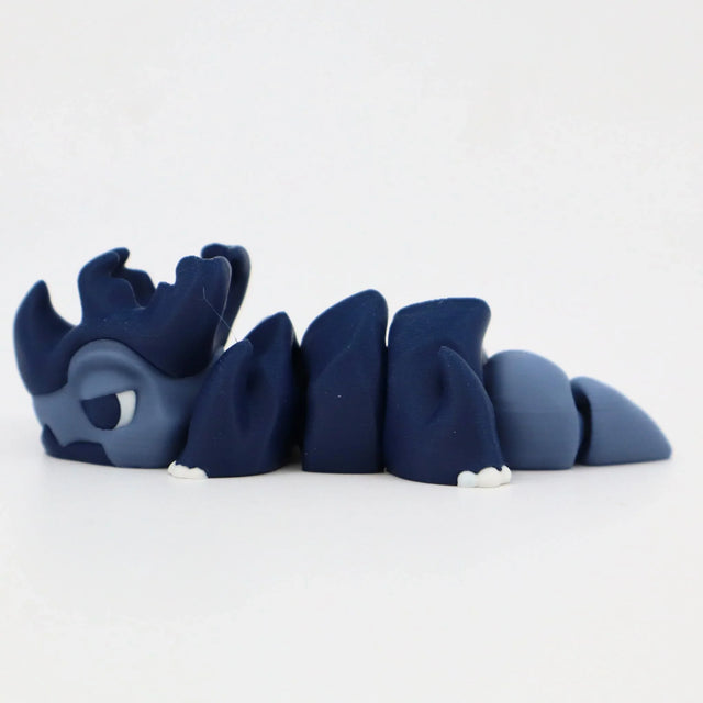 Blue 3D printed segmented sensory toy in the shape of a cartoon sea creature on white background
