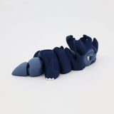 Blue 3D printed articulated sensory toy in the shape of a segmented sea creature on white background