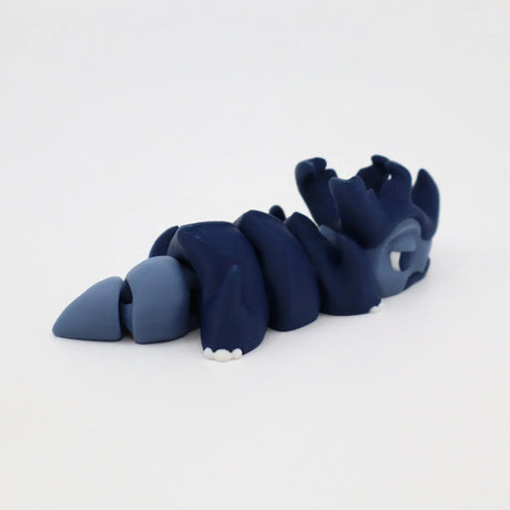 Blue 3D printed articulated sensory toy in the shape of a segmented sea creature on white background