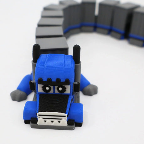 Blue 3D printed truck fidget toy with flexible gray trailer for sensory play