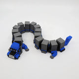 Blue 3D printed truck fidget toy with gray cargo trailers, bendable sensory toy for kids