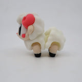 3D printed sensory toy sheep with textured white body, pink cheeks, and black hooves on white background