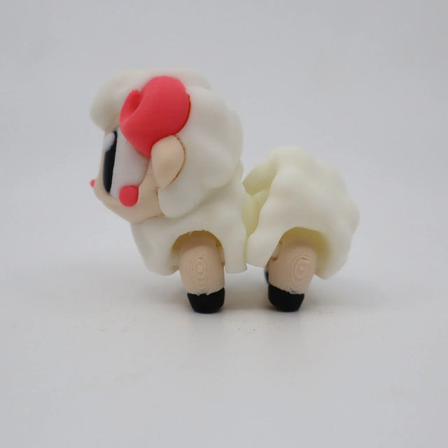 3D printed sensory toy sheep with textured white body, pink cheeks, and black hooves on white background