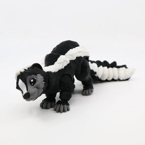 Black and white 3D printed skunk sensory toy with articulated segments on white background